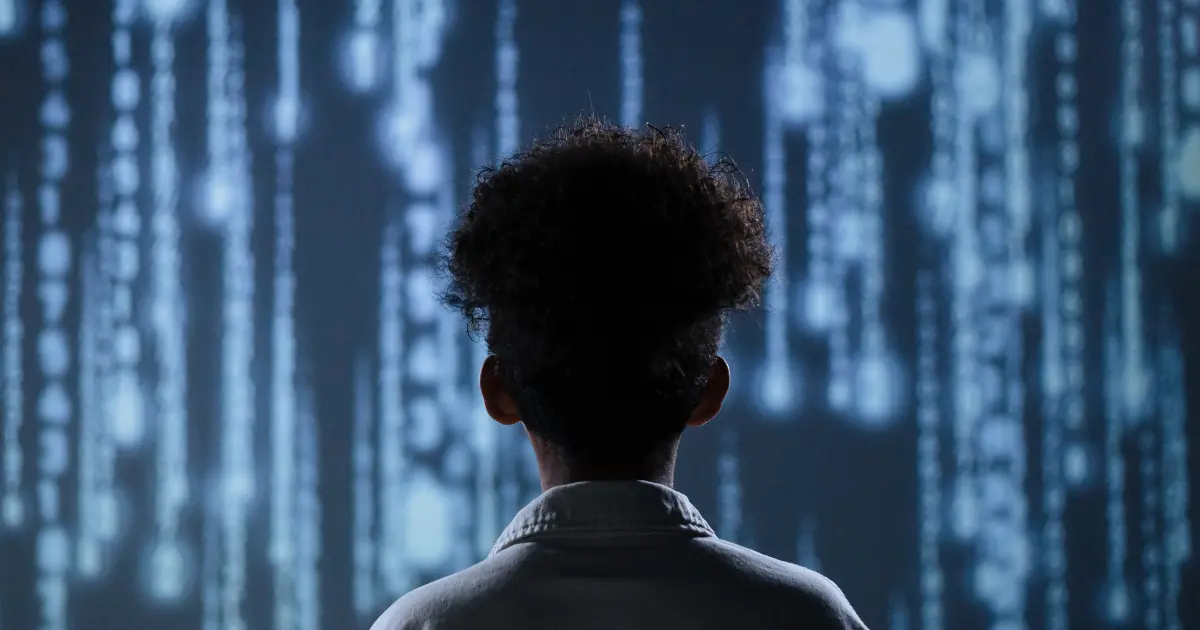 a person standing in front of futuristic looking screen